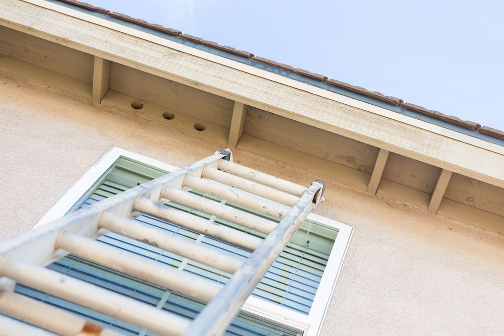 Construction Ladder Leaning Against House
