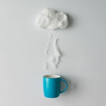 Cup of coffee with cotton wool cloud