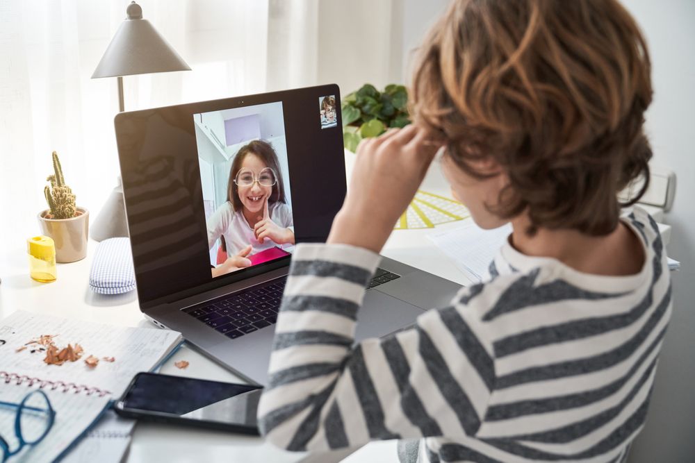 Boy having video call with friend