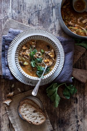 Bread and parsley near quinoa soup