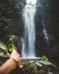 Traveler exploring amazing waterfall in jungles