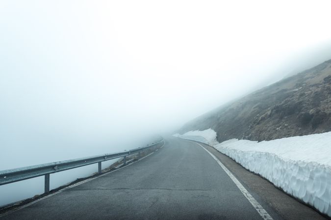 Road in foggy mountains