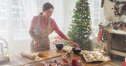 Portrait of Female Preparing Dough for Making Gingerbread for Christmas at Home.