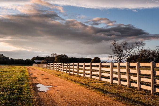 Sunset shot of wooden fence along rural country road in Alabama