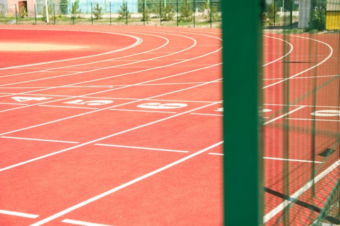 Start of red athletic track with numbers. Sport concept