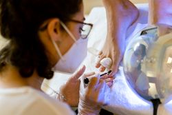 Toe nails being painted in spa