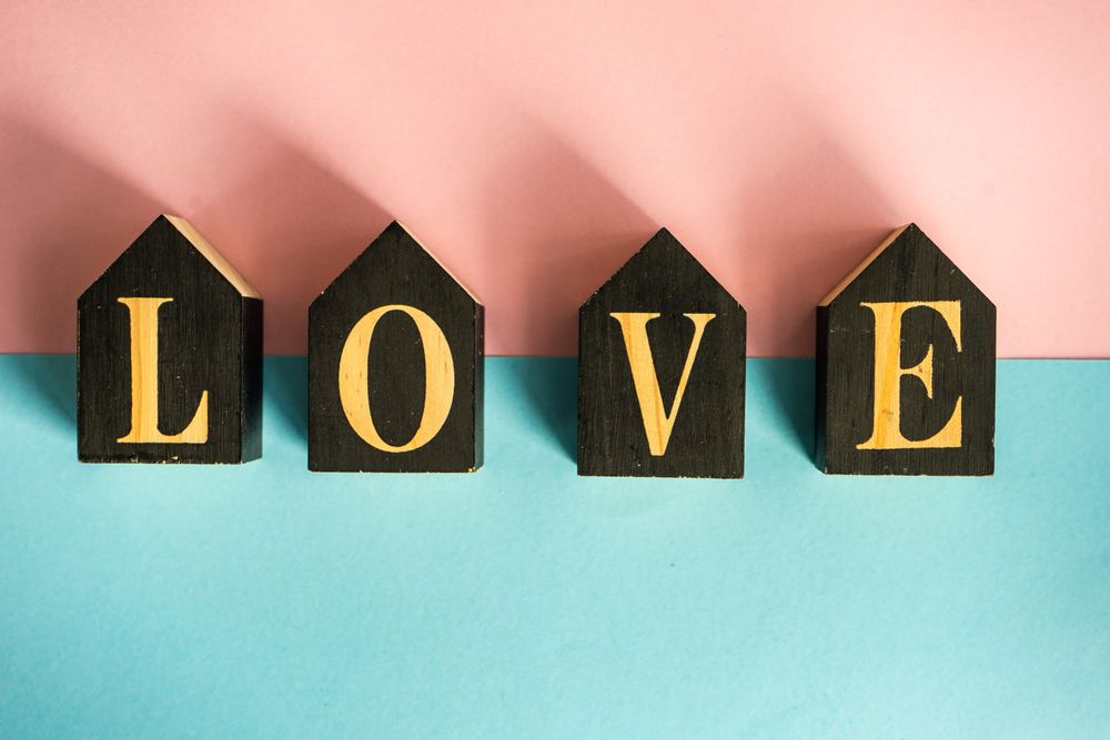 Blue and pink pastel table with the word "love"