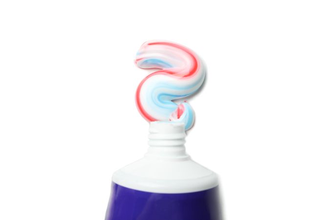 Tube with toothpaste isolated on light background