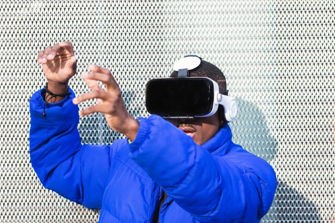 Black man experiencing virtual reality in city