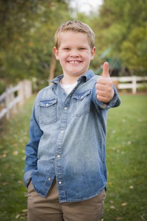 Handsome Young Boy Giving the Thumbs Up