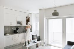 Woman taking from top on kitchen