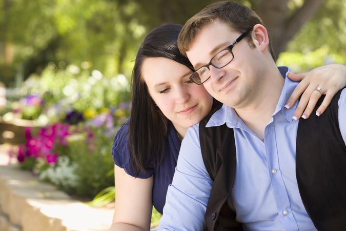 Young Engaged Couple Relaxing in the Park