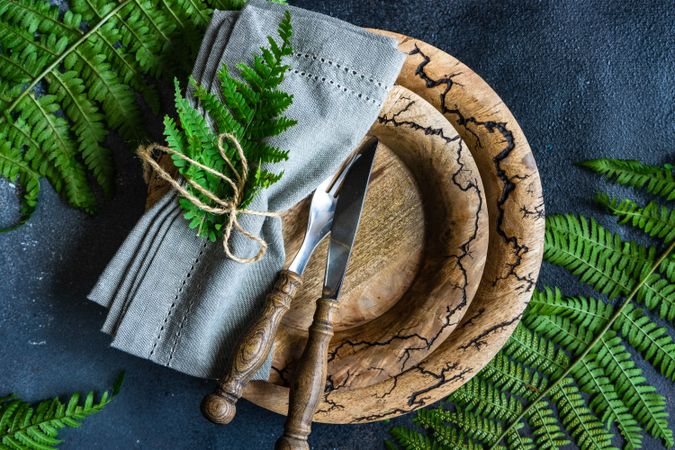 Top view of rustic summer table setting with fern