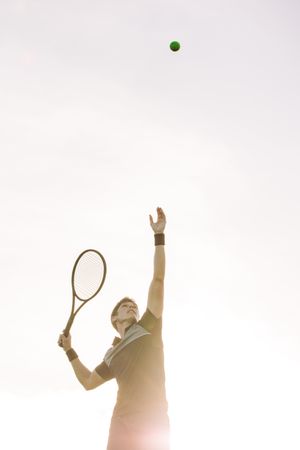 Tennis player serve a ball in a match