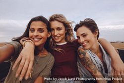 Beautiful women taking selfie while traveling by a pickup truck 47vp65