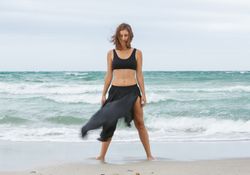woman dancing near sea