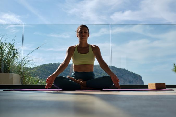 Woman meditating in Lotus pose