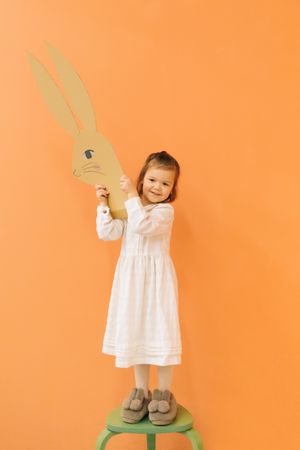 Little girl with paper bunny