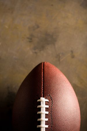 American football ball on dark background