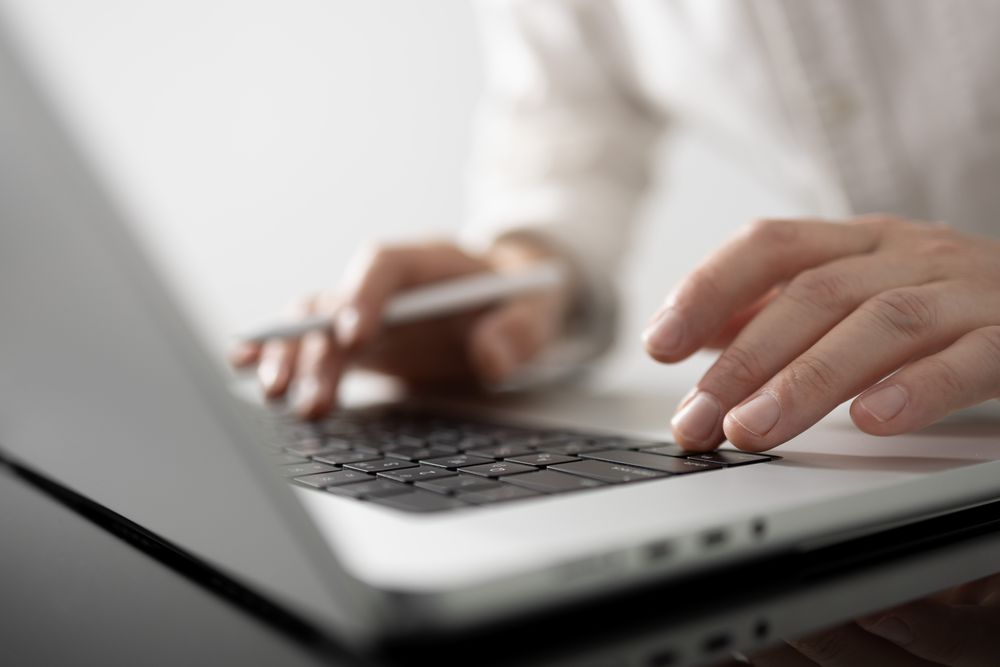 Stylish Businessman Working on Laptop