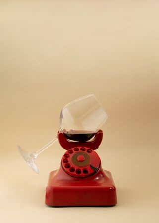 Vintage rotary phone with red wine ear piece