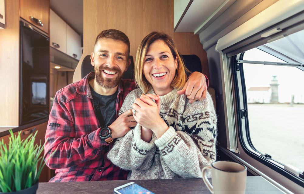Friendly man and woman looking at camera as if chatting on video call
