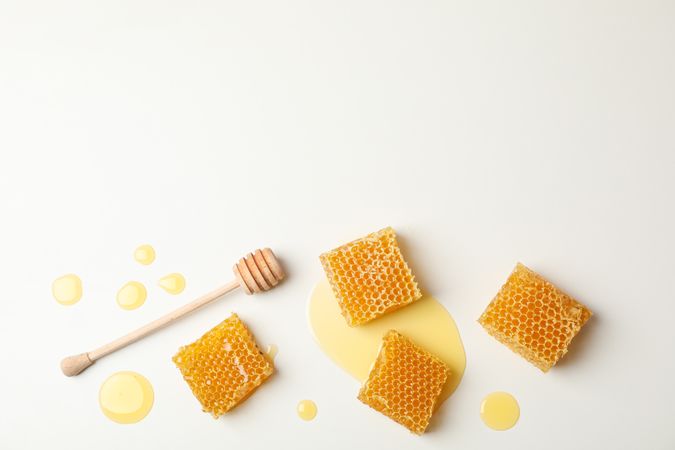 Honeycombs and dipper on blank background, space for text