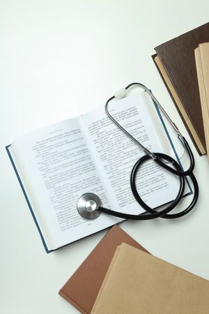 Concept of medical education and books, top view