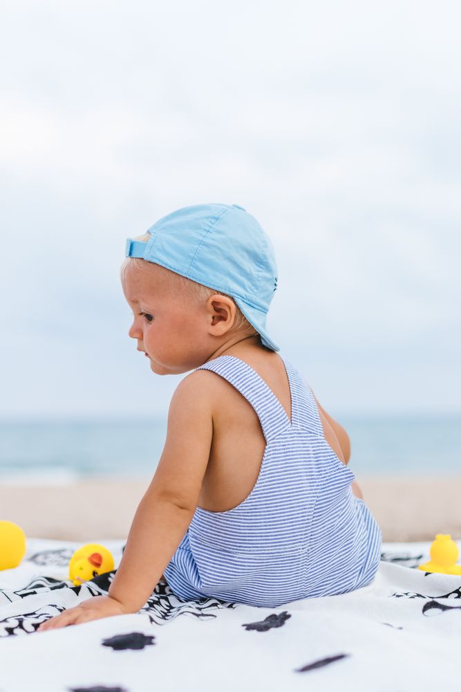 Rear view of a baby with a cap