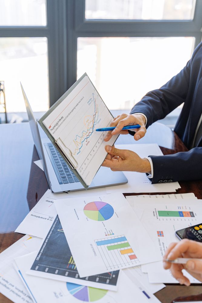 Cropped image of business man holding a pivot table