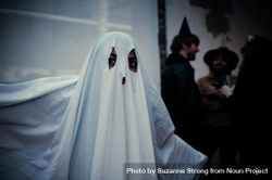 Portrait of a person in ghost costume at Halloween party 0LZKD4