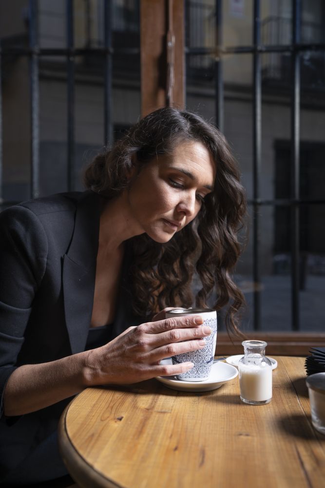 Young female with tea cup in cafe