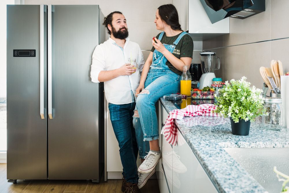 Couple eating healthy food in kitchen