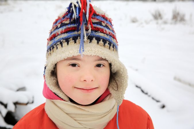 Portrait of young child playing in the cold weather