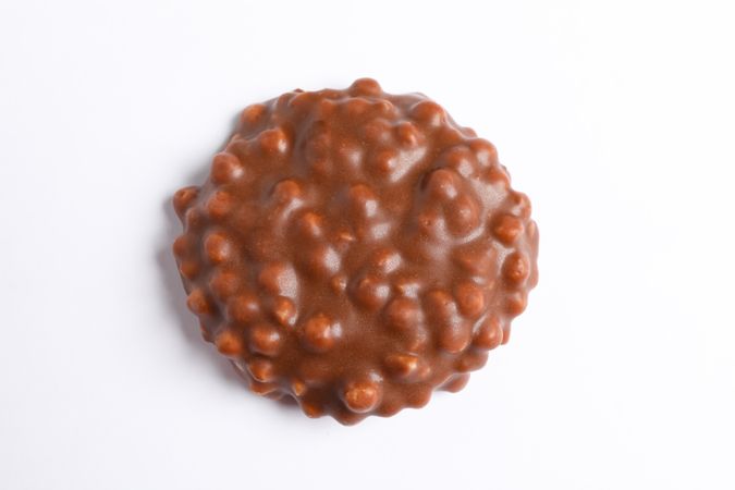Chocolate cookie with caramel filling on blank background