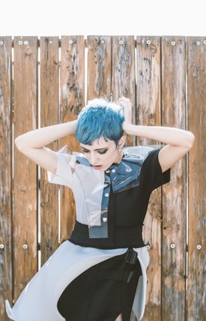 Beautiful informal model against wooden fence