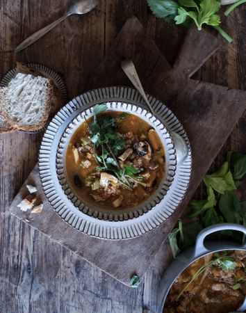 Bread and parsley near quinoa soup