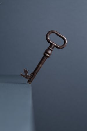 Vintage Key in balance at the edge of the table