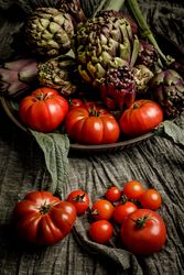 Assorted vegetables and napkins on table