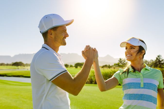 Professional golfers shaking hands after the game
