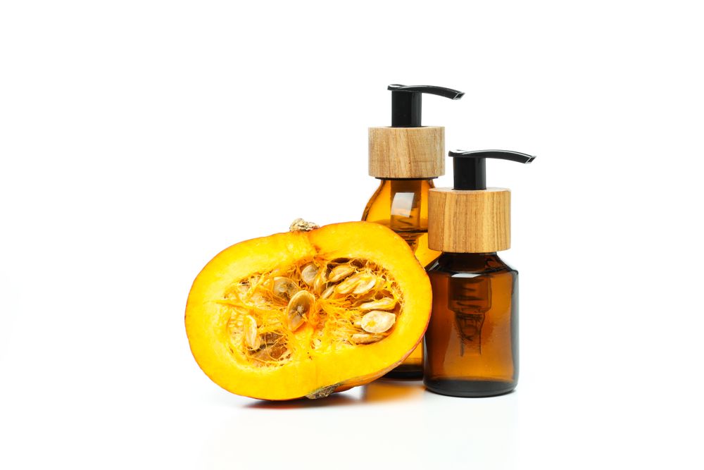 Skin care and body care concept - pumpkin cosmetic, isolated on blank background
