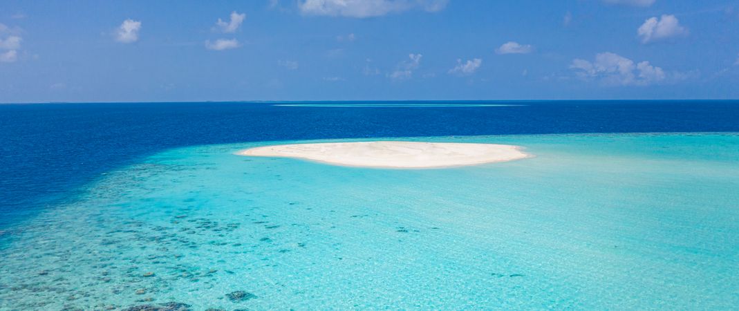 Wide shot of clear blue water in the Maldives