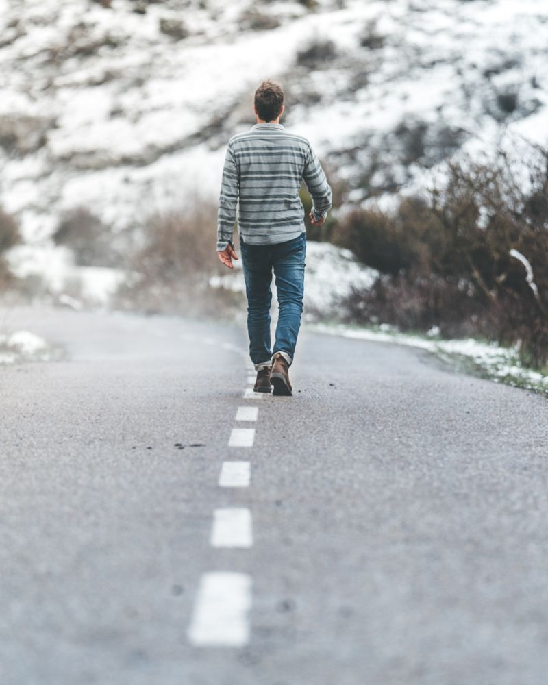 Man walking on country road