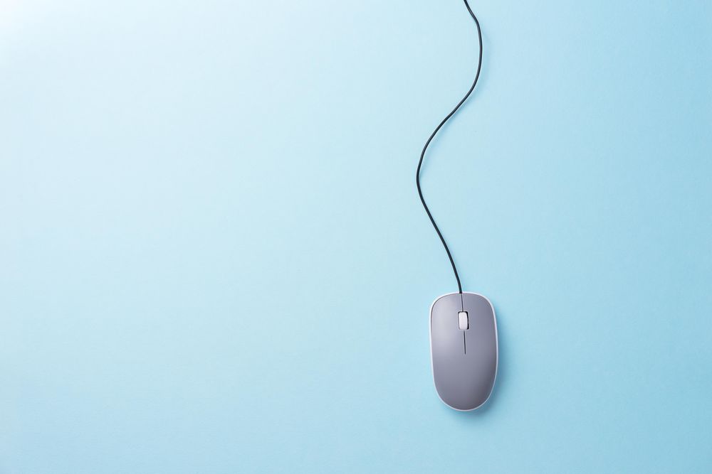 Computer mouse with cable attached on light blue background - Free Photo  (42Ljg0) - Noun Project