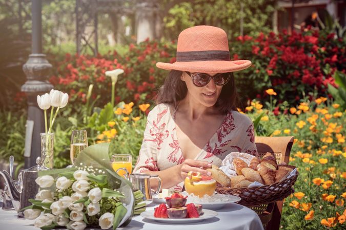 Woman Enjoying Breakfast in the Garden