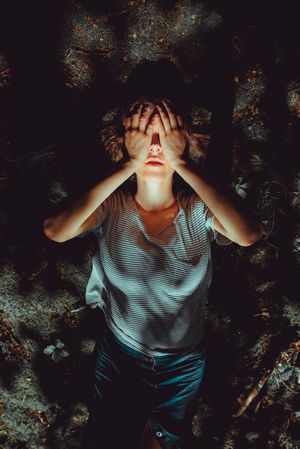 Woman lying on ground
