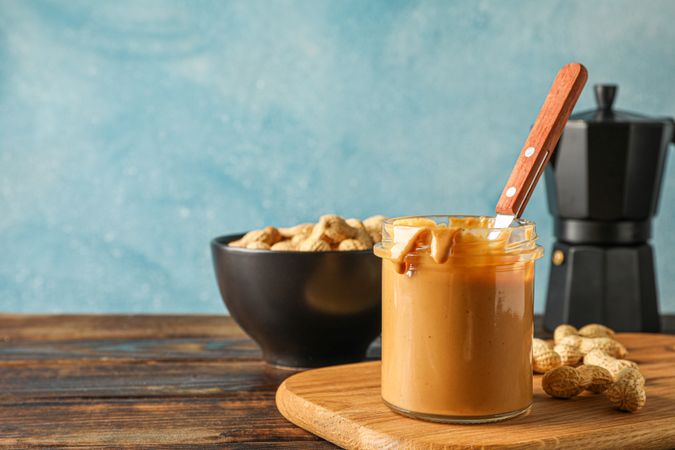 Yummy breakfast composition on wooden table against light background, space for text. Traditional product of American cuisine