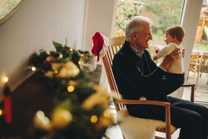 Older man with his grandson on a christmas eve