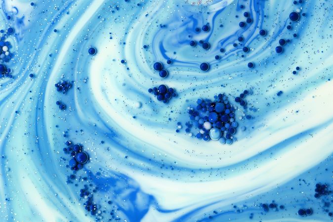 Abstract blue background of color stains and bubbles