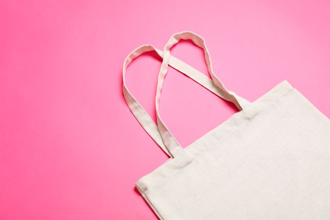 Eco bag on color background, space for text